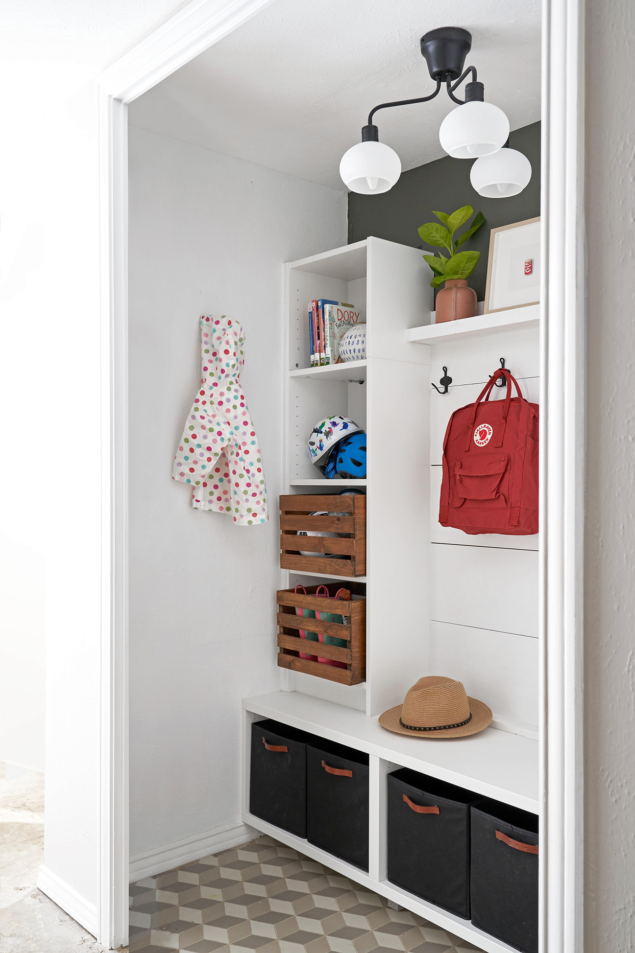 Entryway with large built-in storage for hats, bags, and coats.