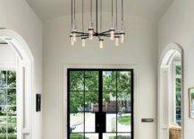 Entryway with unique chandelier and glass front door.
