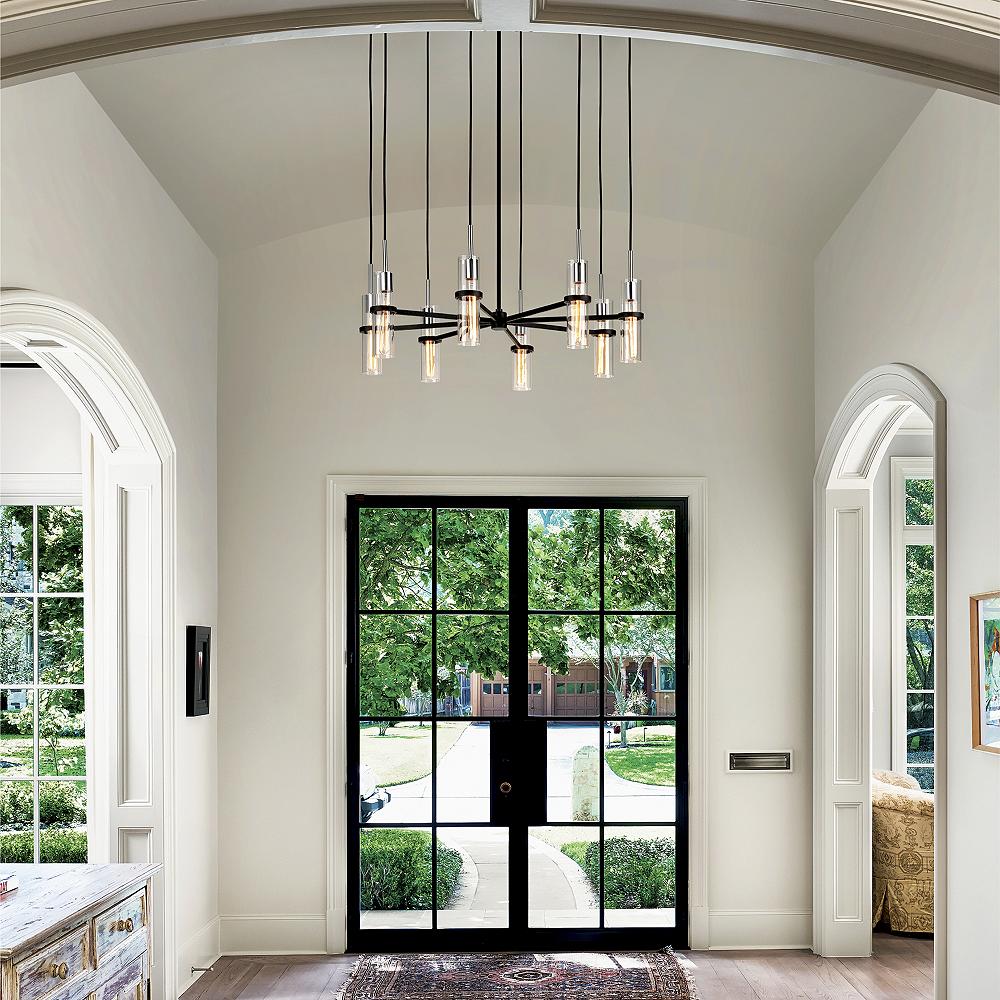 Entryway with unique chandelier and glass front door.