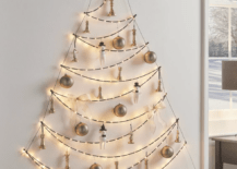 string lights on wall in shape of christmas tree with ornaments
