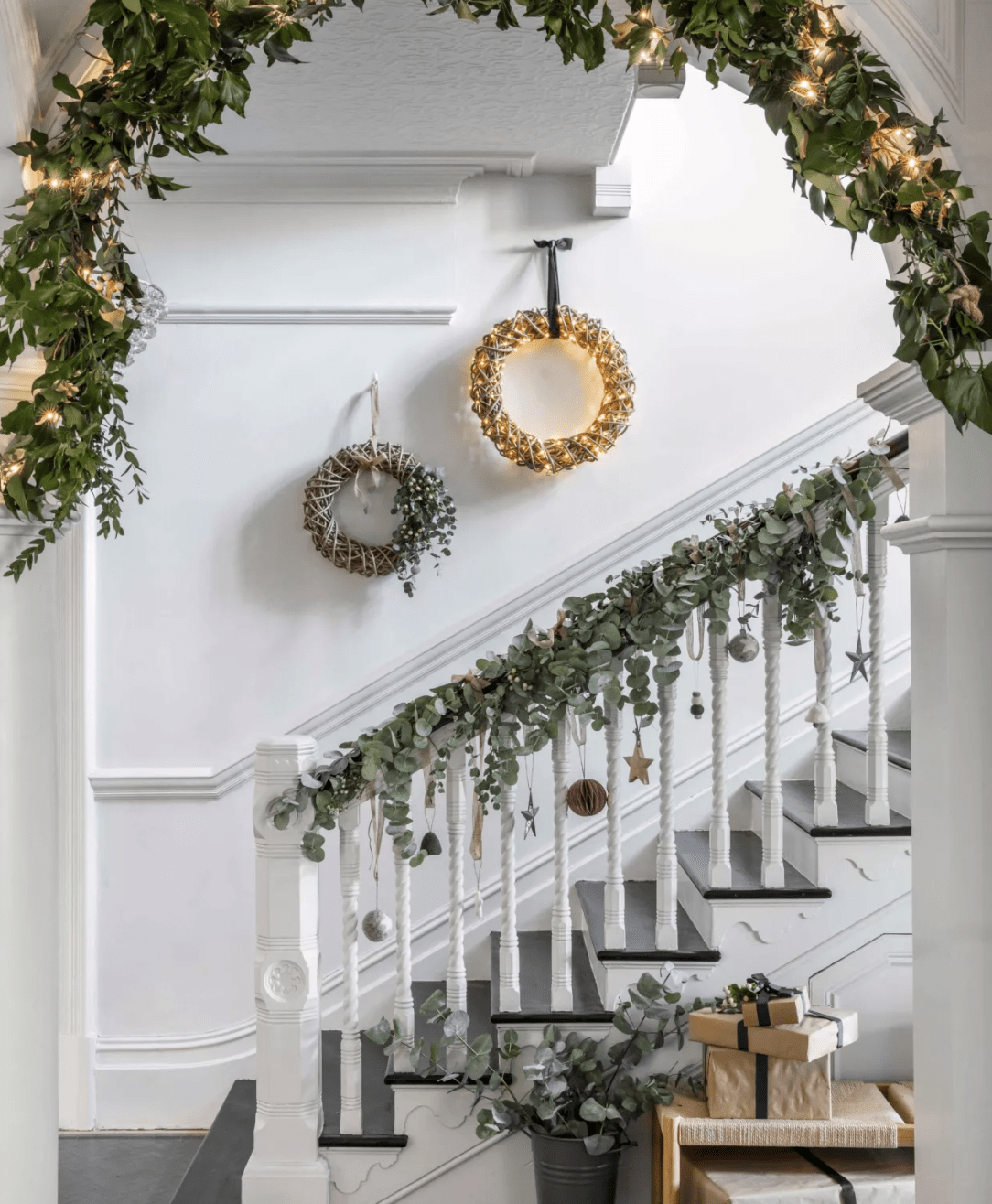 christmas garlands and lights on stairwell