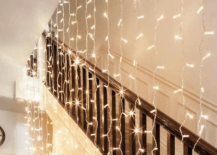 hanging string lights in stairway