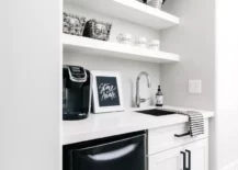 Black and white coffee bar with sink.