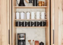 Coffee bar in a natural bamboo wood cabinet.