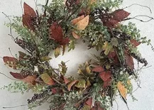 fall burgundy wreath with leaves and greenery