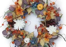 fall wreath with white dahlia pumpkin and purple eucalyptus