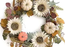 white pumpkin wreath with sunflowers leaves autumn front door