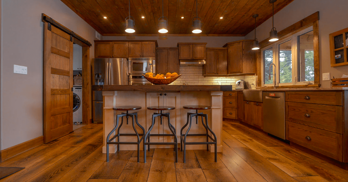 Rustic kitchen with reclaimed wood flooring.