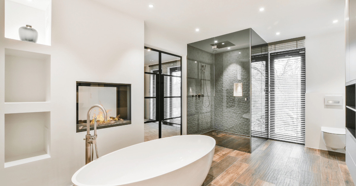 Wet room bathroom with glass shower walls and modern fixtures.