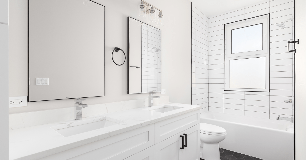 White bathroom with subway tile shower.