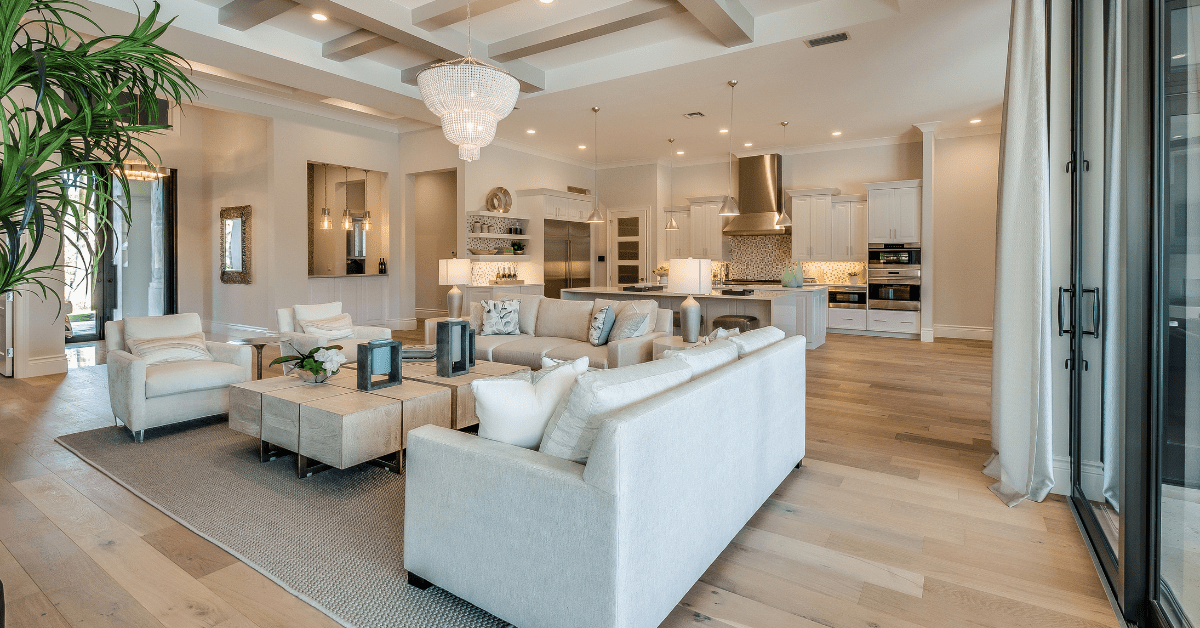 A large living room with open concept connecting to kitchen.