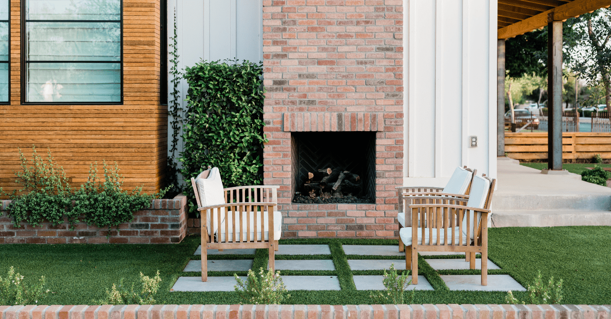 Exterior seating area of a home with concrete pavers and patio furniture.
