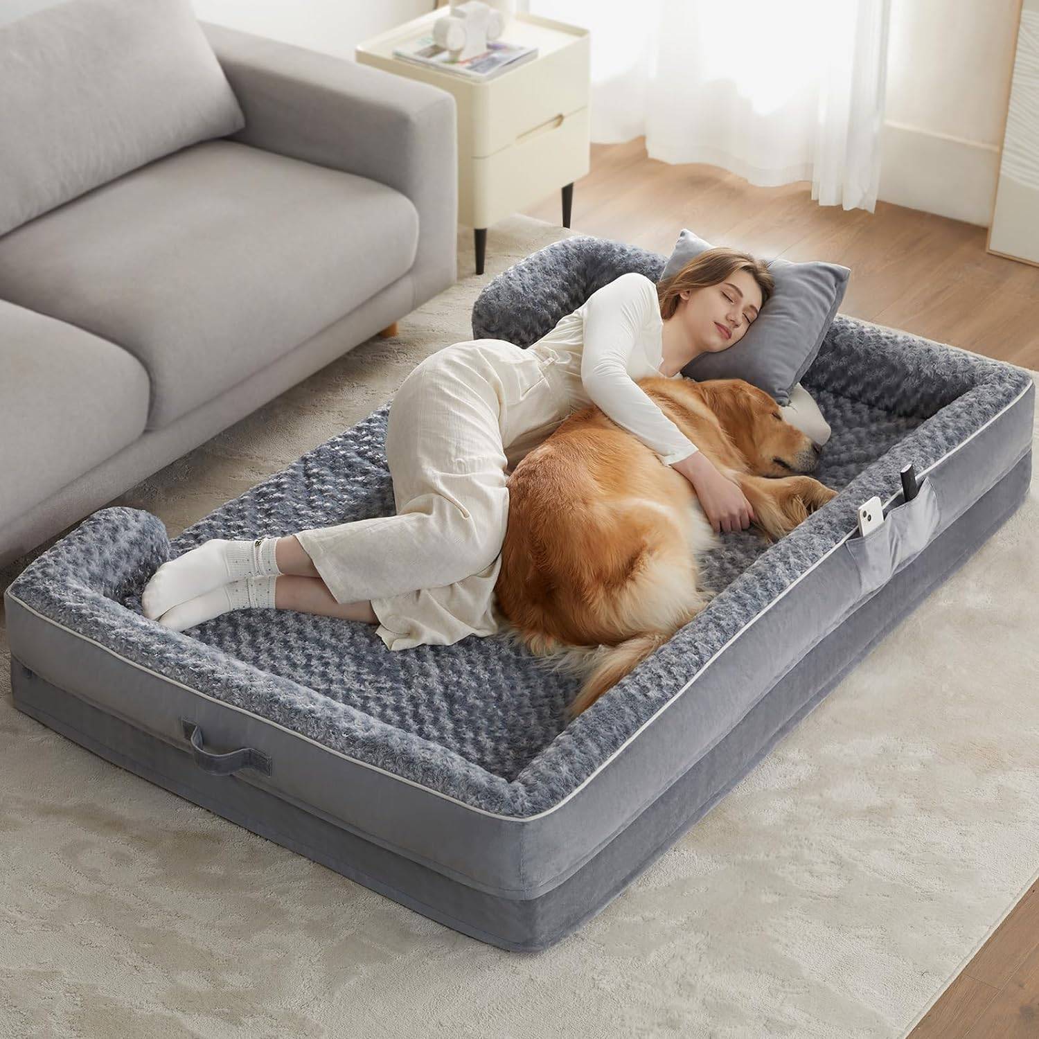 human dog bed with woman and golden retriever sleeping in it