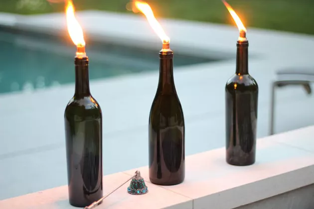 wine bottle tiki torch by pool